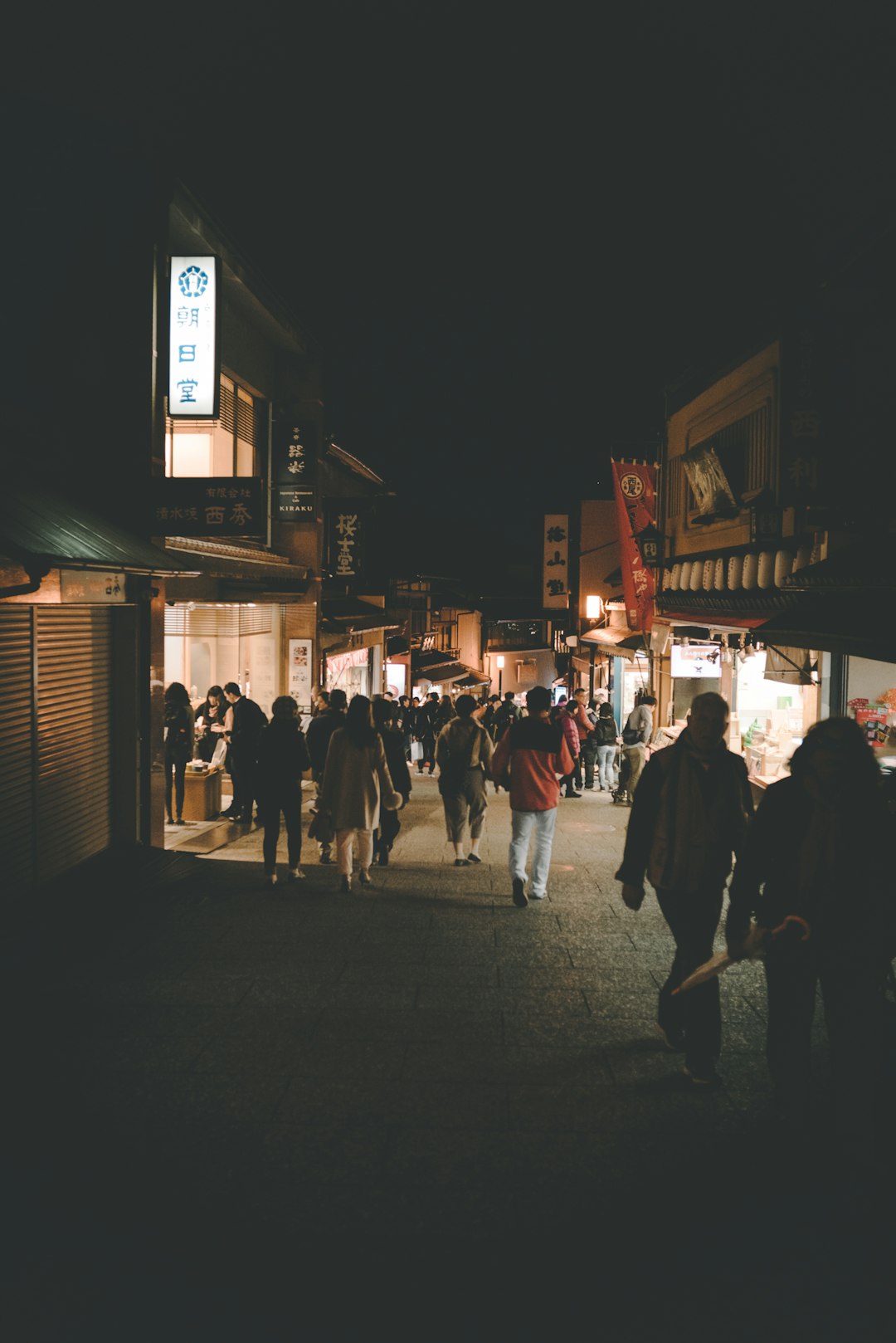 people walking on streets during nighttime