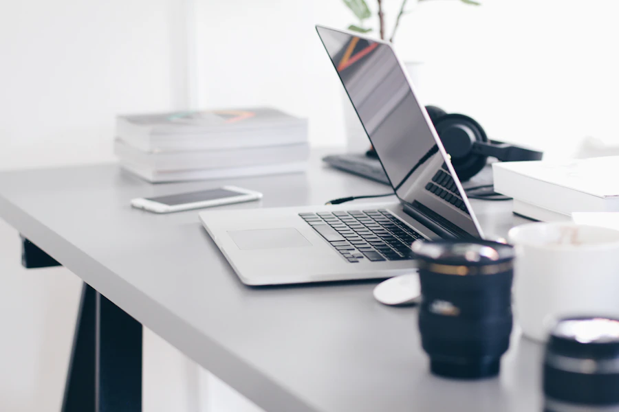 Laptop and phone on a desk, representing web design and digital marketing