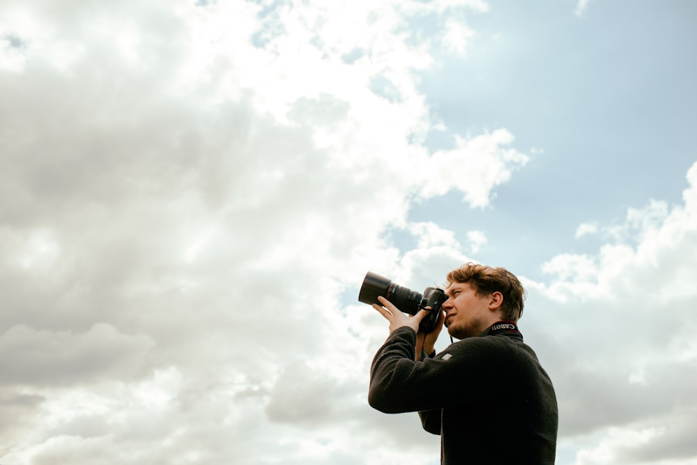 a man taking a picture with a camera