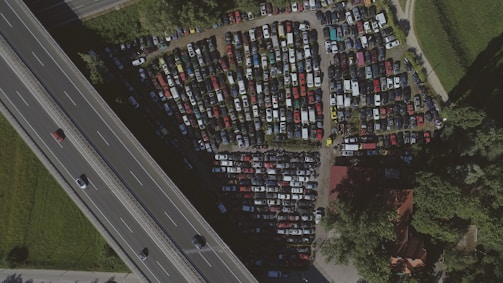 Aerial view of a busy parking lot with cars entering and exiting