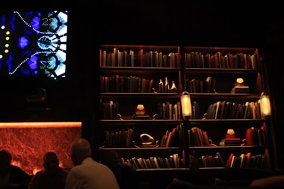 A bookshelves-filled media room with press members preparing festival coverage.