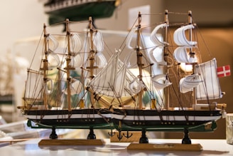 A beautiful handcrafted wooden model ship displayed elegantly.