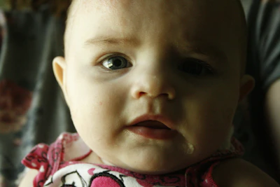 Close-up of a stylish baby clothing shoot with soft natural light highlighting textures and colors.