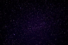 A vast expanse of a starry night sky filled with countless stars of varying brightness scattered across the dark canvas.