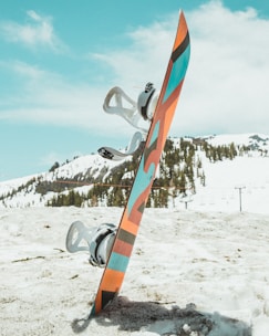 shallow focus photography of multicolored snowboard