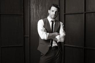 A sleek black and white photo of a confident influencer showcasing a high-end grooming product.