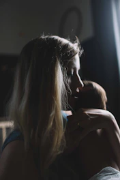woman carrying baby