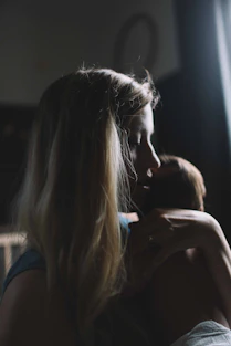 woman carrying baby