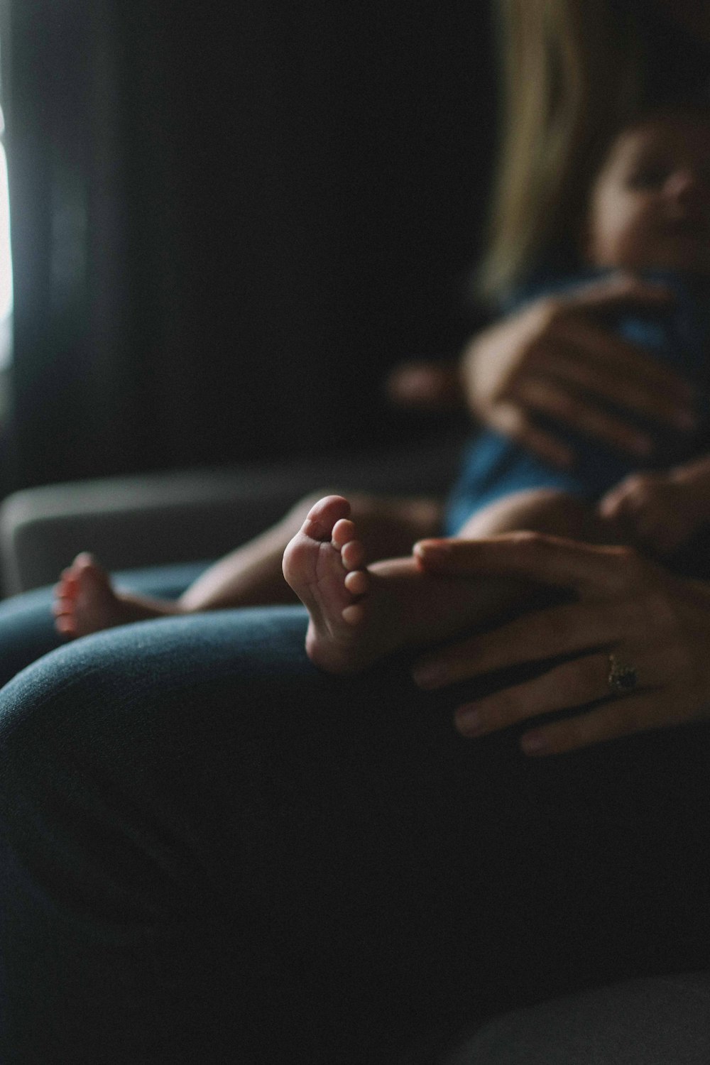 person carrying baby on lap