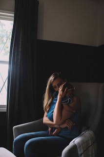 A serene breastfeeding area with a comfortable chair and soft lighting.