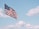 flag of U.S.A. under white clouds during daytime