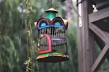 A cozy pet cage with vibrant colors and features.