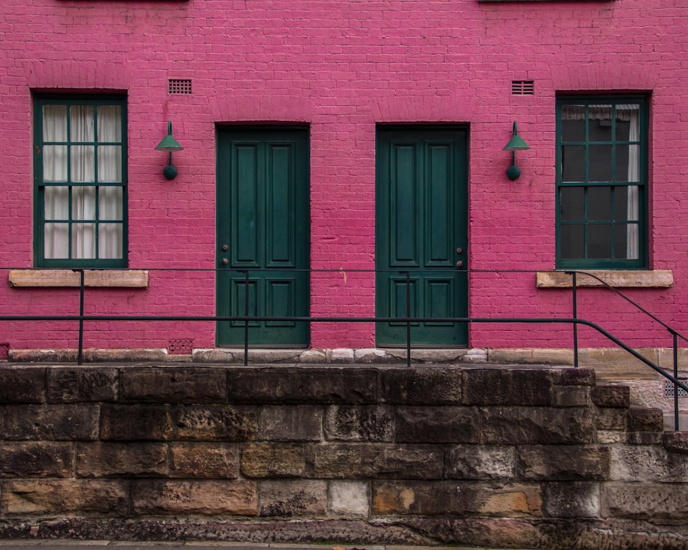 pink house with two doors