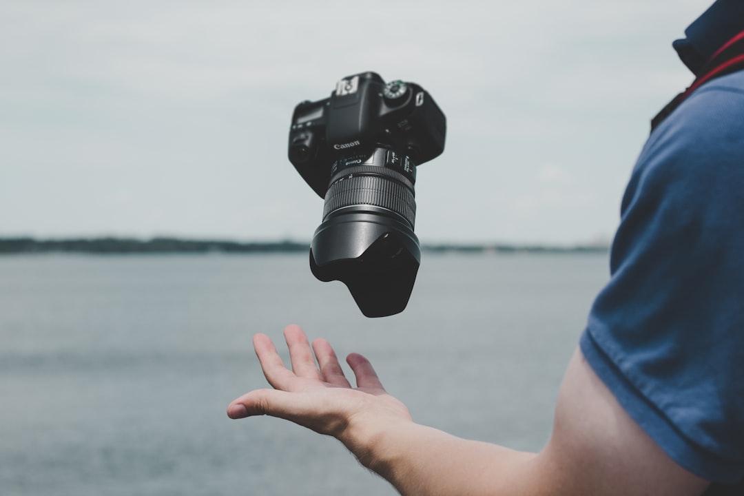 black Canon DSLR camera,