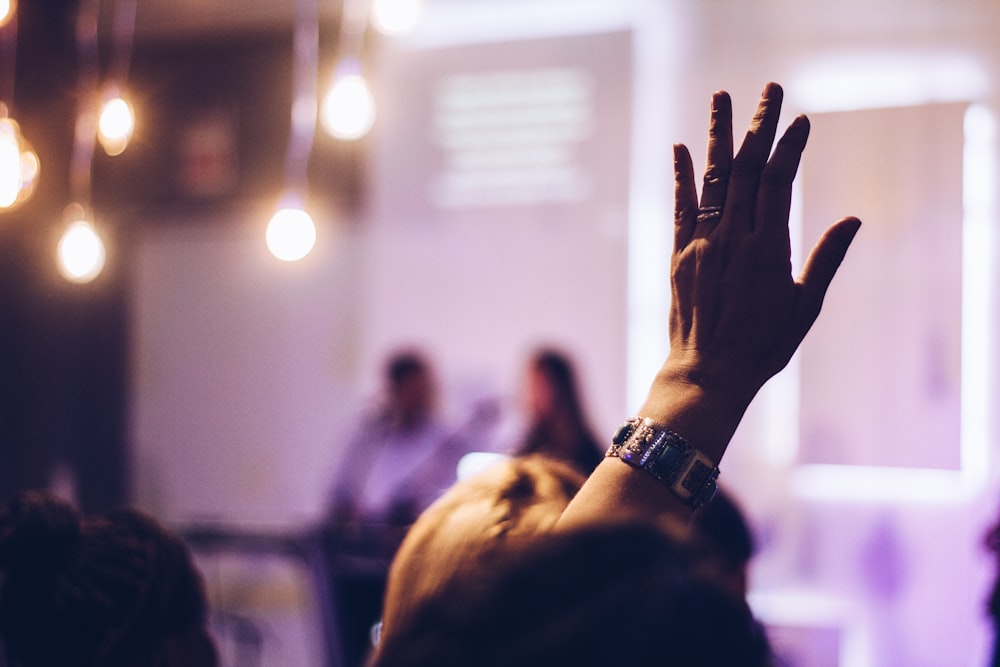 person raising hand