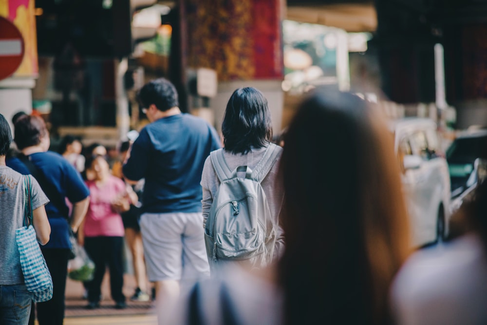 woman standing in the middle of crowd