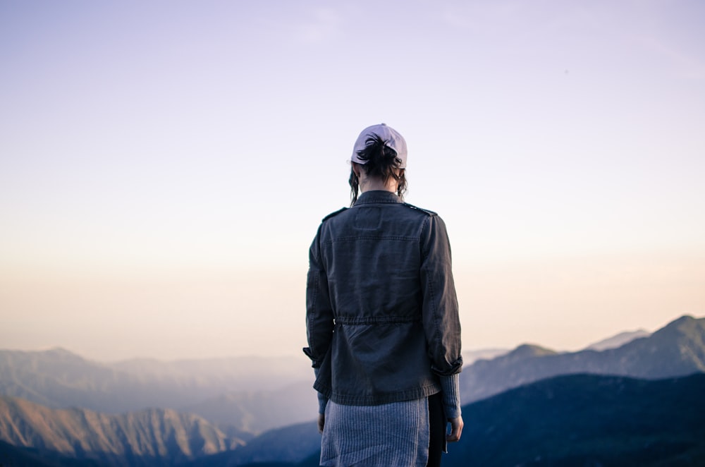 person standing near mountain during daytime