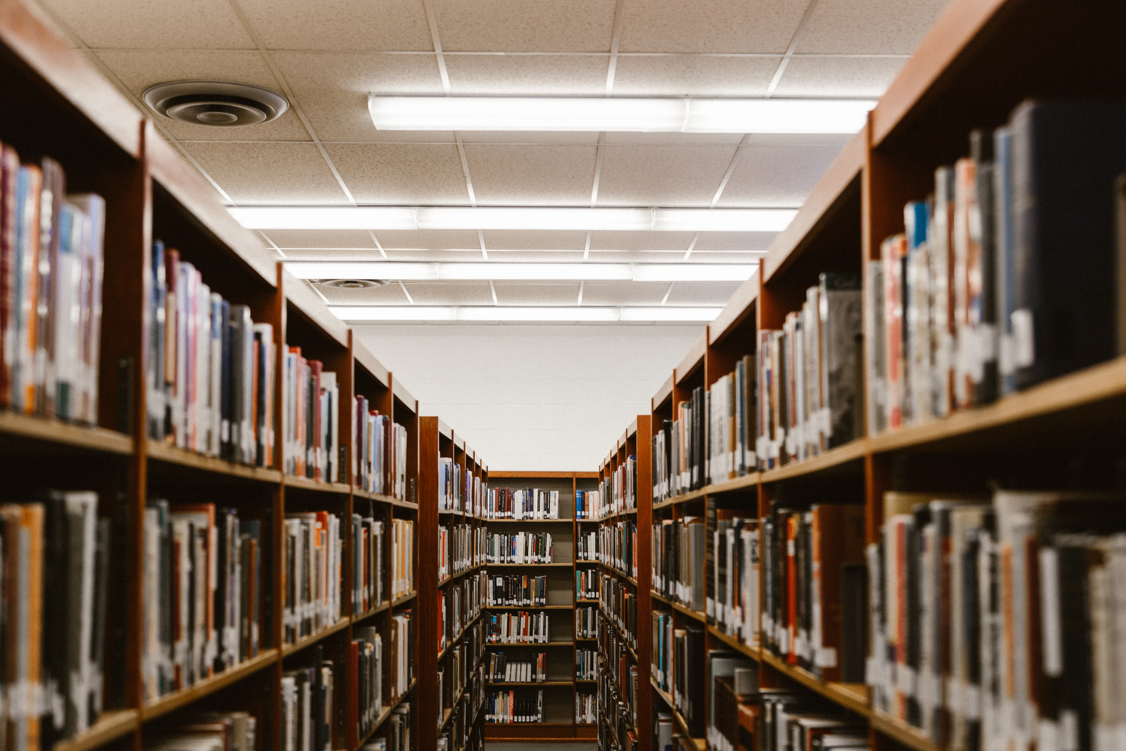 Tall rows of bookshelves in the school library