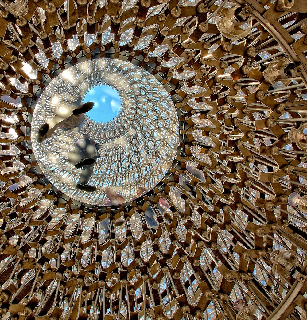 a circular mirror with a reflection of a person in it