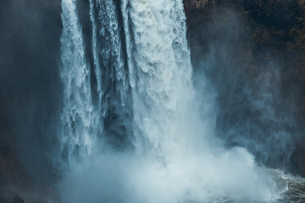 photo of waterfalls rushing into the sea