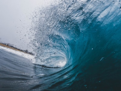 time-lapse photography of ocean waves wave teams background