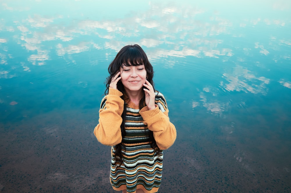 women's black, white, and yellow striped shirt