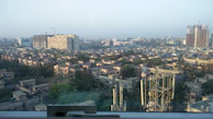 A panoramic view of a bustling real estate market area in Delhi NCR, showing diverse property options.