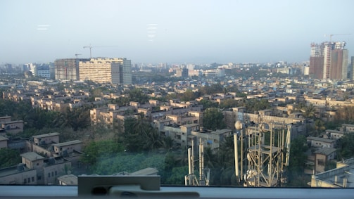 A panoramic view of a newly urbanized residential area with modern streets and green spaces.