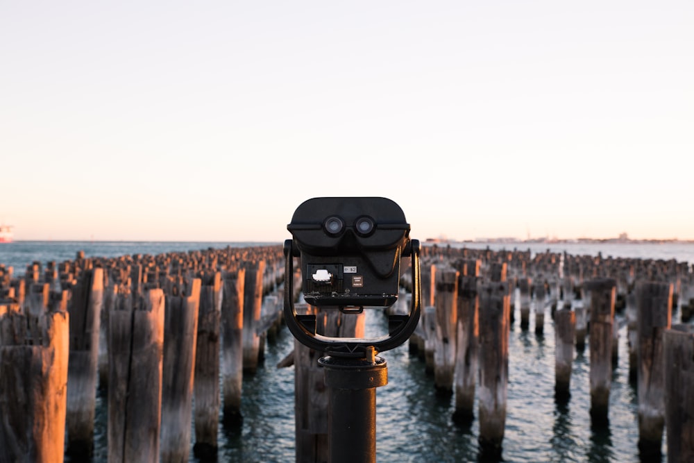 shallow focus photo of black telescope