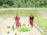 African women farmers working together in a lush green field.