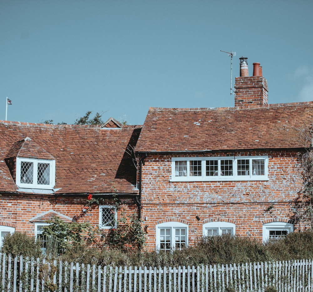 two brown brick houses