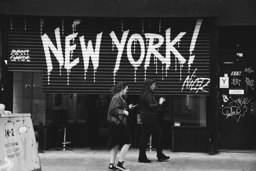Black and white photo of two women walking