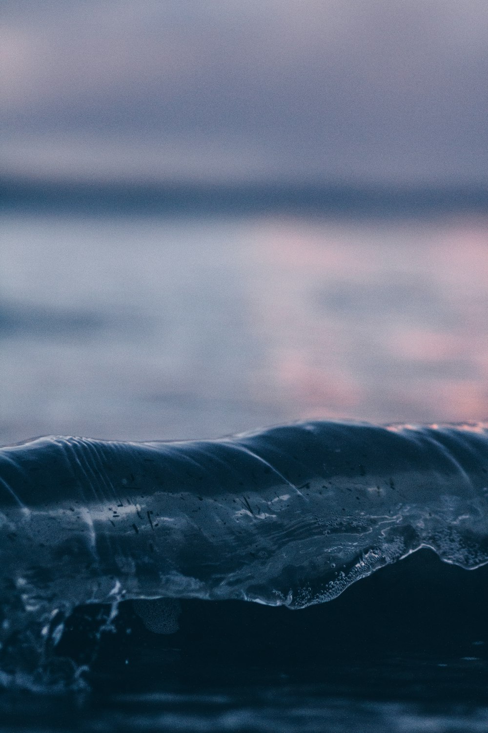 shallow focus photography of water wave