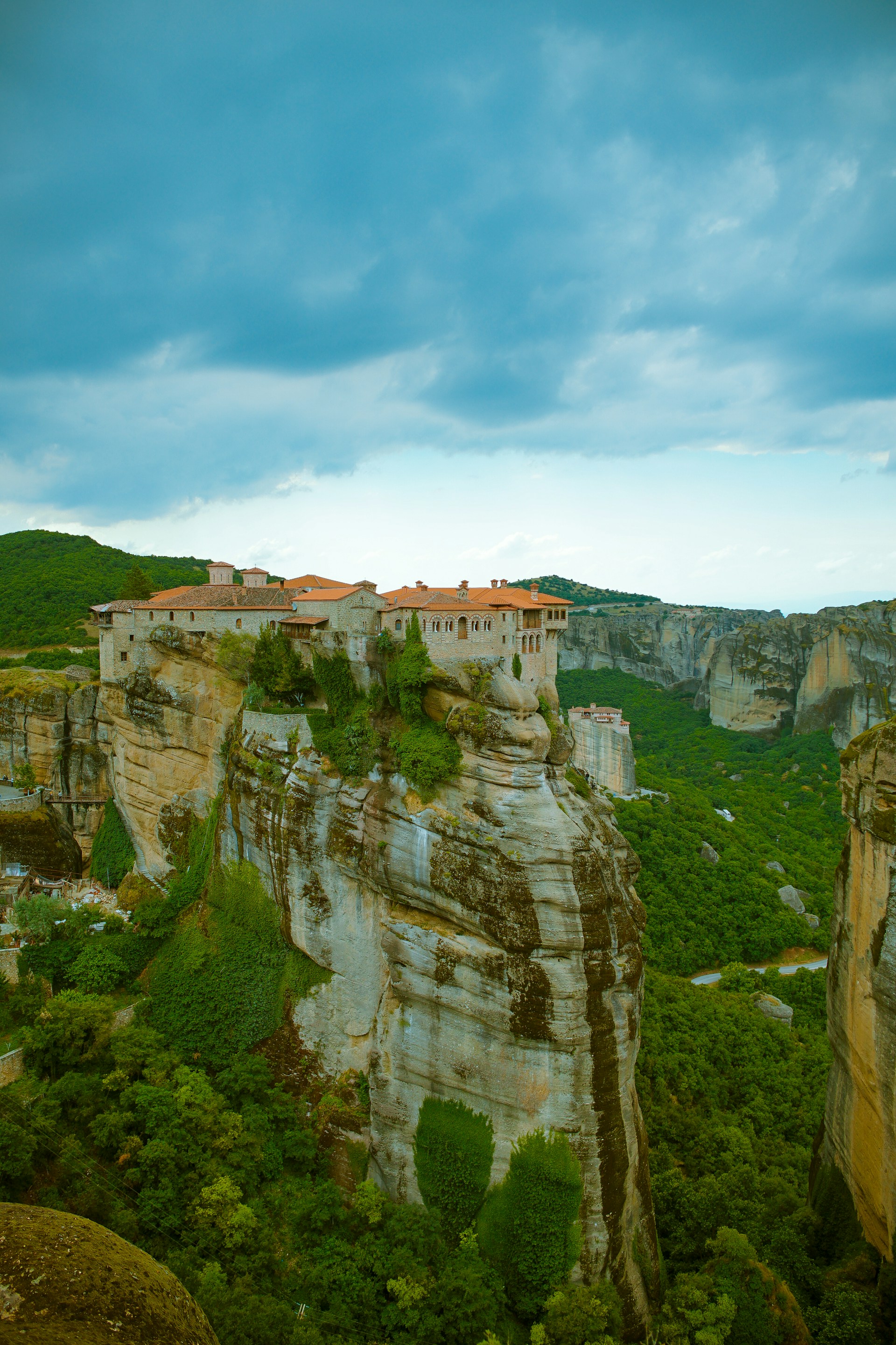A tranquil scene of a secluded monastery nestled among lush greenery on the Holy Mountain.