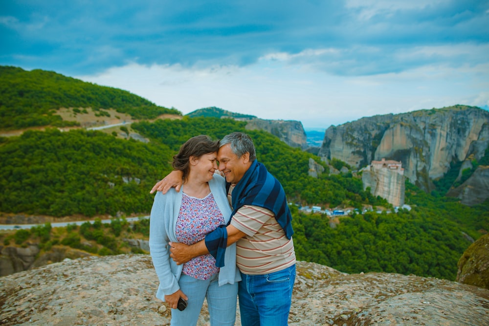 Anniversary Gift Ideas For Older Couples: man embracing the woman on top of hill