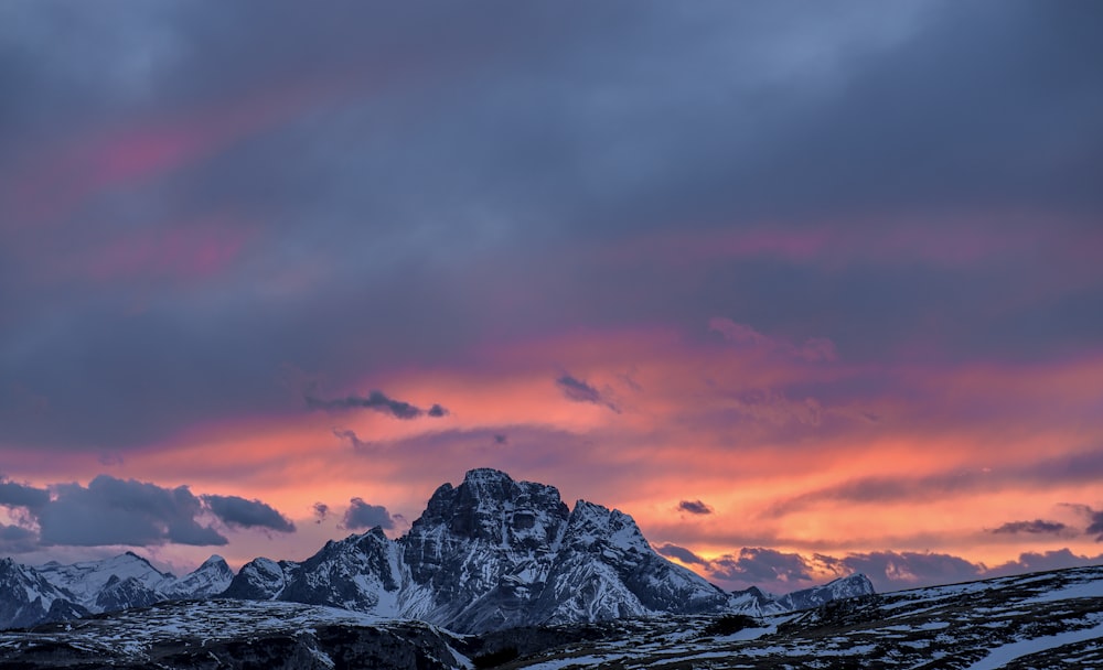 gray and black mountain at sunset