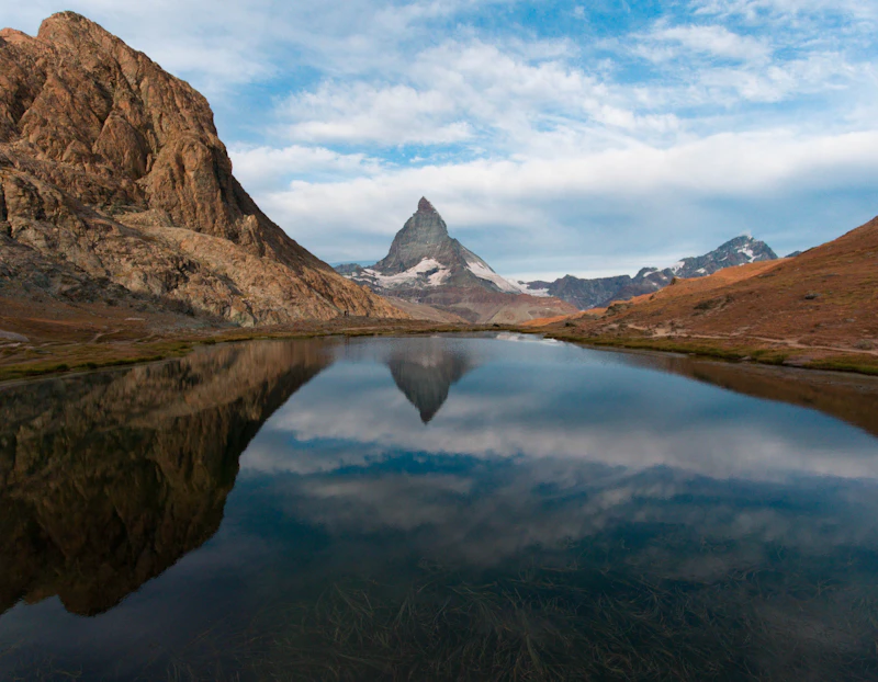 The Matterhorn mirrored in the still water of the Riffelsee above Zermatt