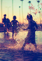 Children playing near the serene lake in Encinos by Altozano during the golden hour.