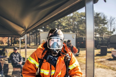 shallow focus photography of firefighter in full suit