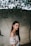 shallow focus photography of woman standing outdoors