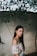 shallow focus photography of woman standing outdoors