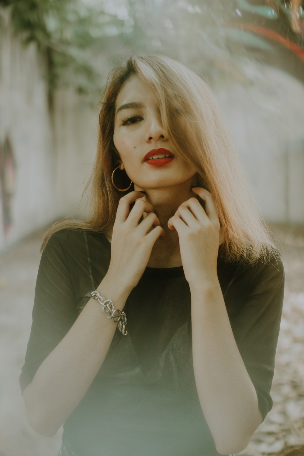 woman wearing black crew-neck elbow-sleeved shirt