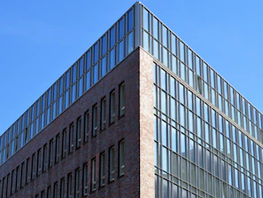 Modern commercial building with glass windows and clean lines.