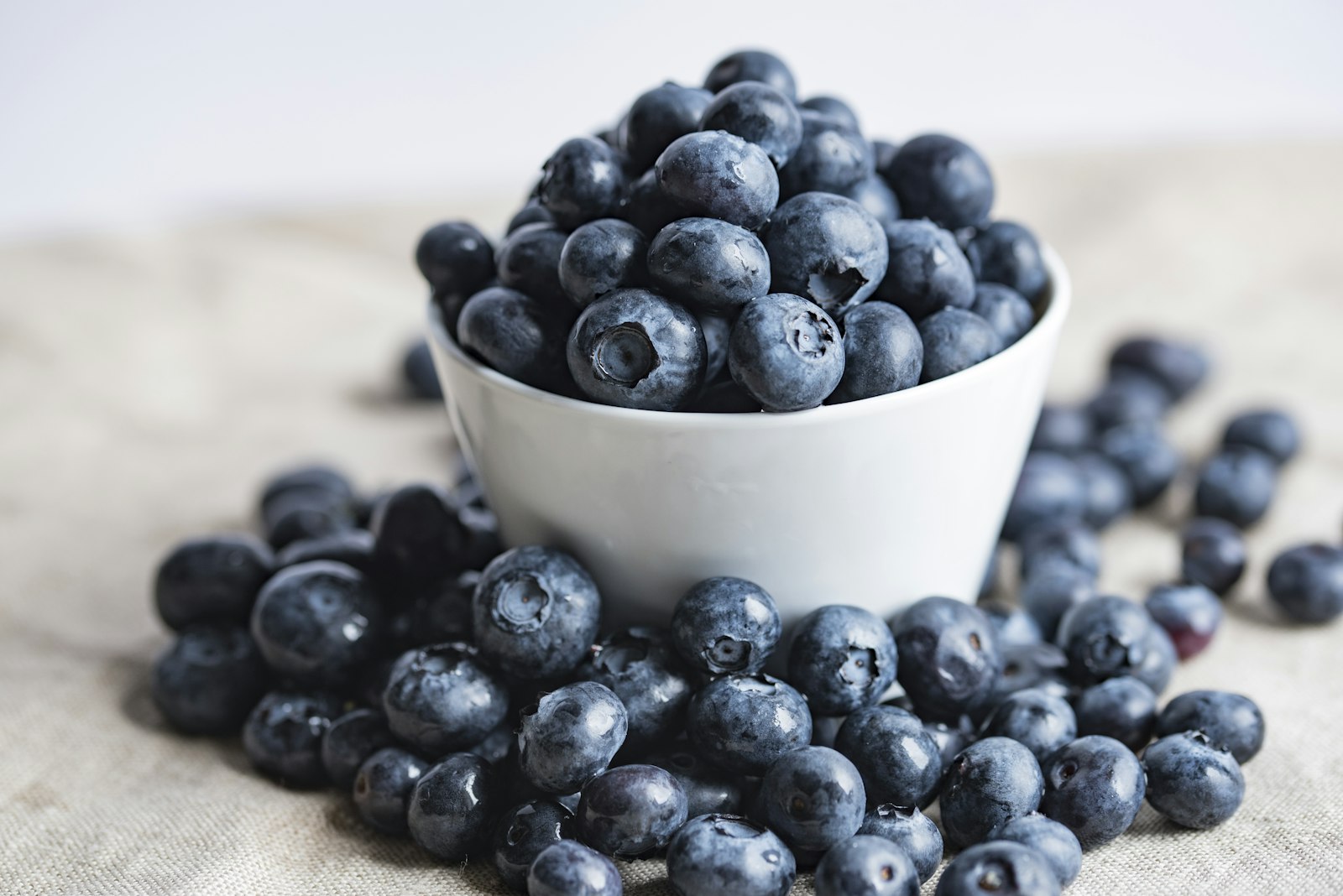 Sigma 105mm F2.8 EX DG OS HSM sample photo. Blueberries on white ceramic photography