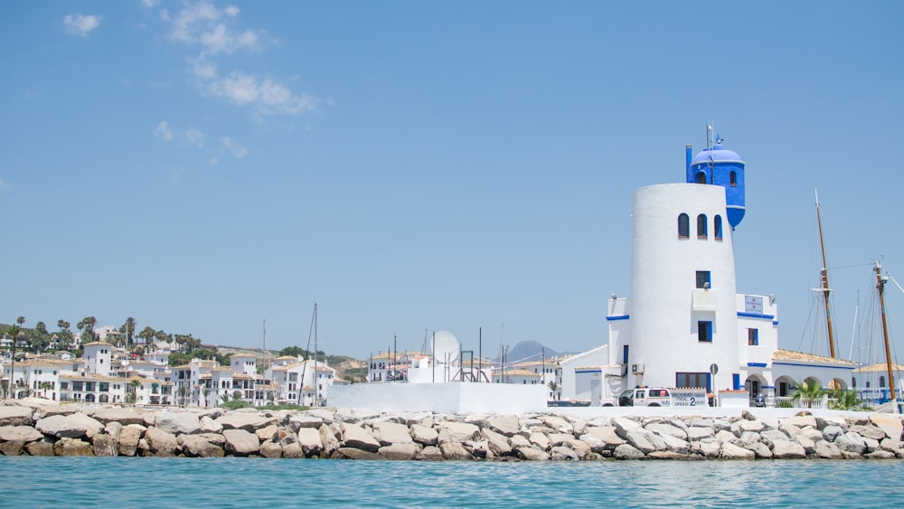 white tower along body of water