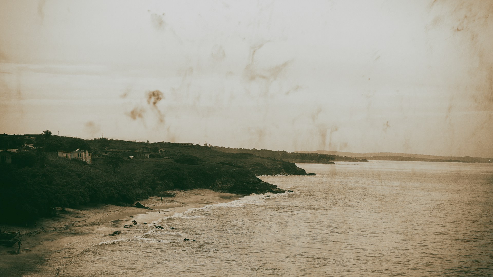 A vintage-style image of a serene beach at sunset, evoking feelings of tranquility and adventure.