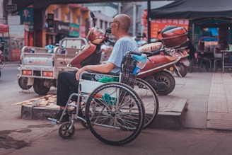 man sitting on wheelchair