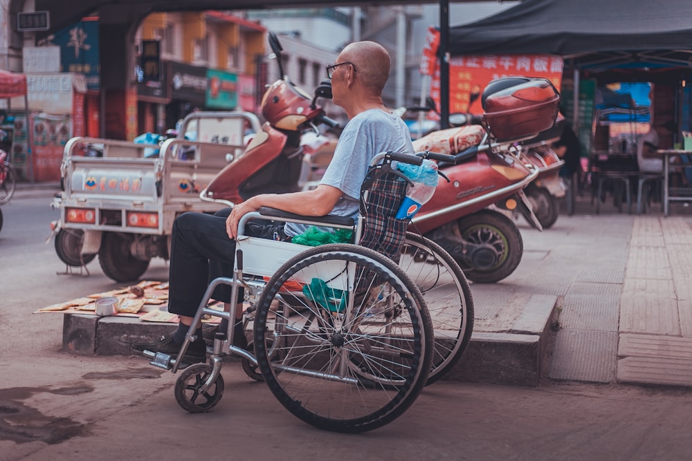 man sitting on wheelchair