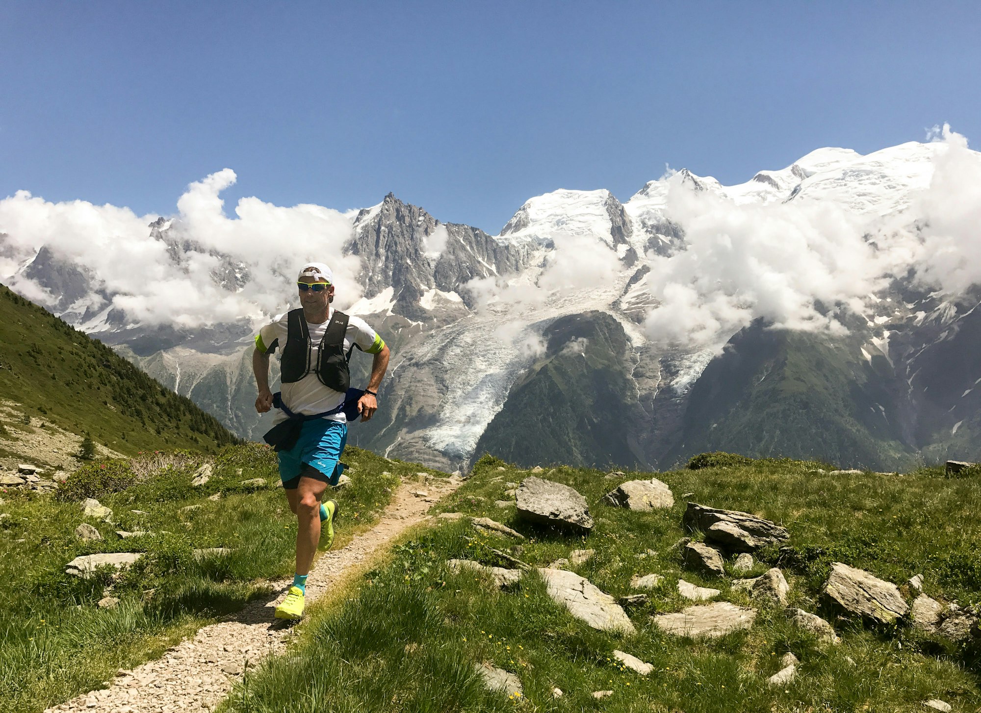 A runner runs on a high-altitude route in Chamonix, France.