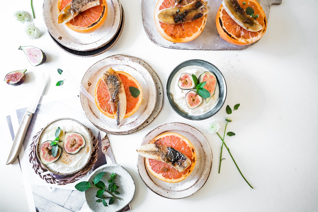 top view of orange dishes, Brulee’d bananas. Brulee’d grapefruit. Bestill my brulee’d heart.